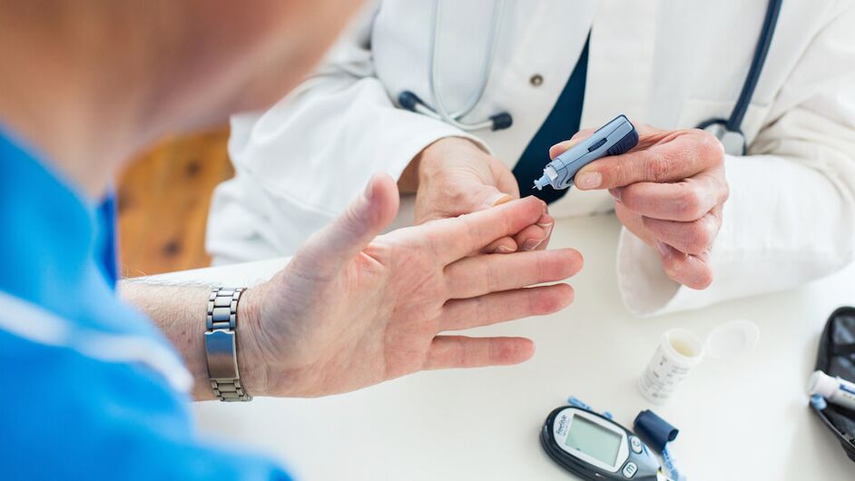 the doctor is taking blood for diabetes